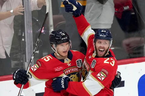 Carter Verhaeghe celebrates his goal with Anton Lundell 